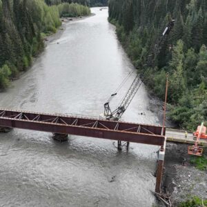 Crane Erecting Steel for the Bell Irving Bridge Project in the River