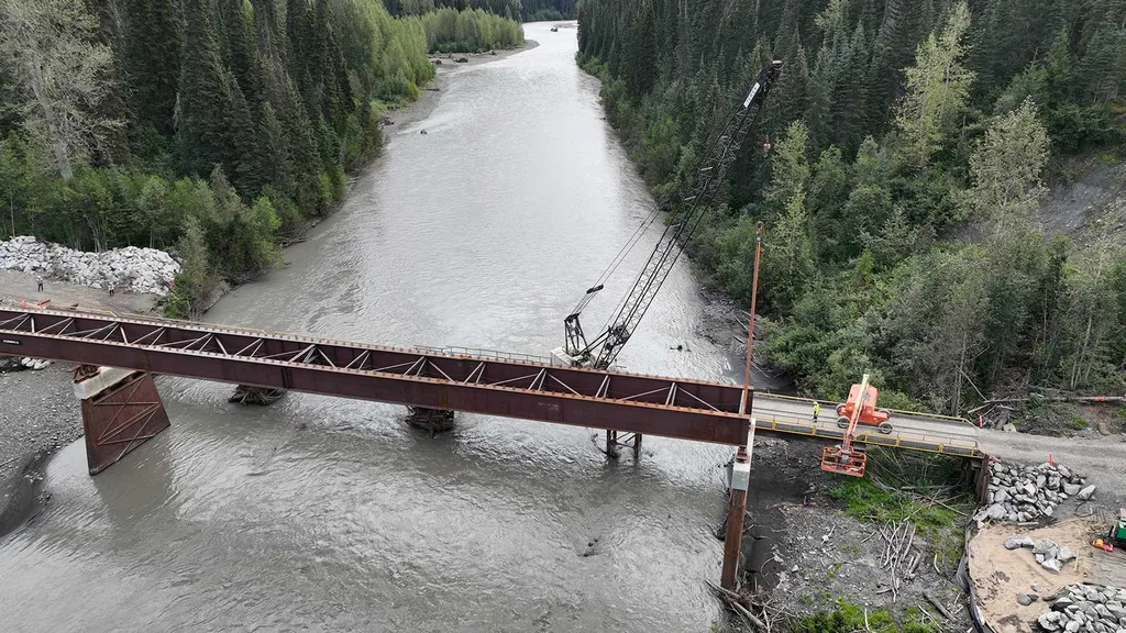 Crane Erecting Steel for the Bell Irving Bridge Project in the River